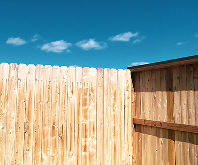 Wood fence, daylight with blue sky